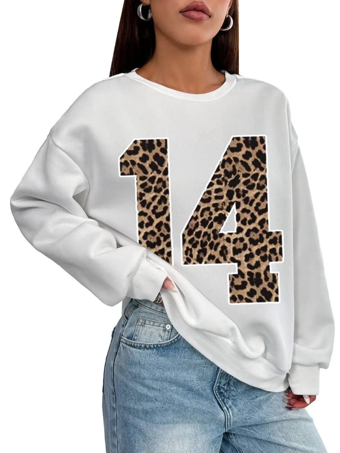 White oversized crew neck sweatshirt featuring a bold black leopard print number 14 on the front.