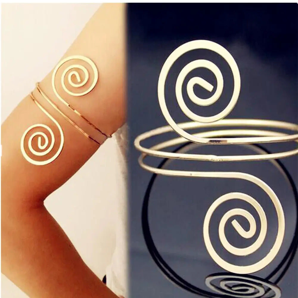 Gold-toned spiral arm cuff with sleek minimalist design as arm ring jewelry.