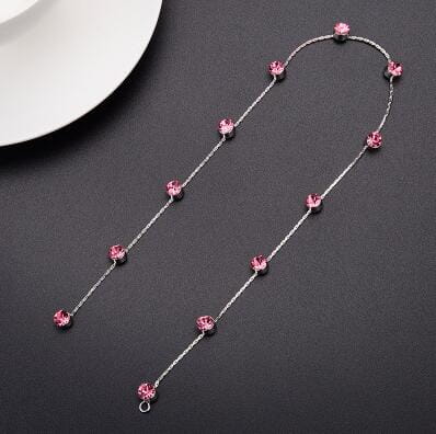 a delicate silver chain wedding hair accessory adorned with evenly spaced pink crystal beads for elegant wedding hair styling