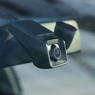 Black rectangular 1080p hd night vision driving recorder with metallic silver lens housing and concentric circular ridges for sleek angular design and parking surveillance