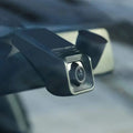 Black rectangular 1080p hd night vision driving recorder with silver-rimmed lens and sleek angular design mounted on windshield