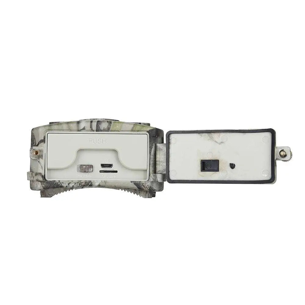 Back side of a camouflage-patterned waterproof 1080p trail camera with night vision featuring usb and power switch for wildlife monitoring