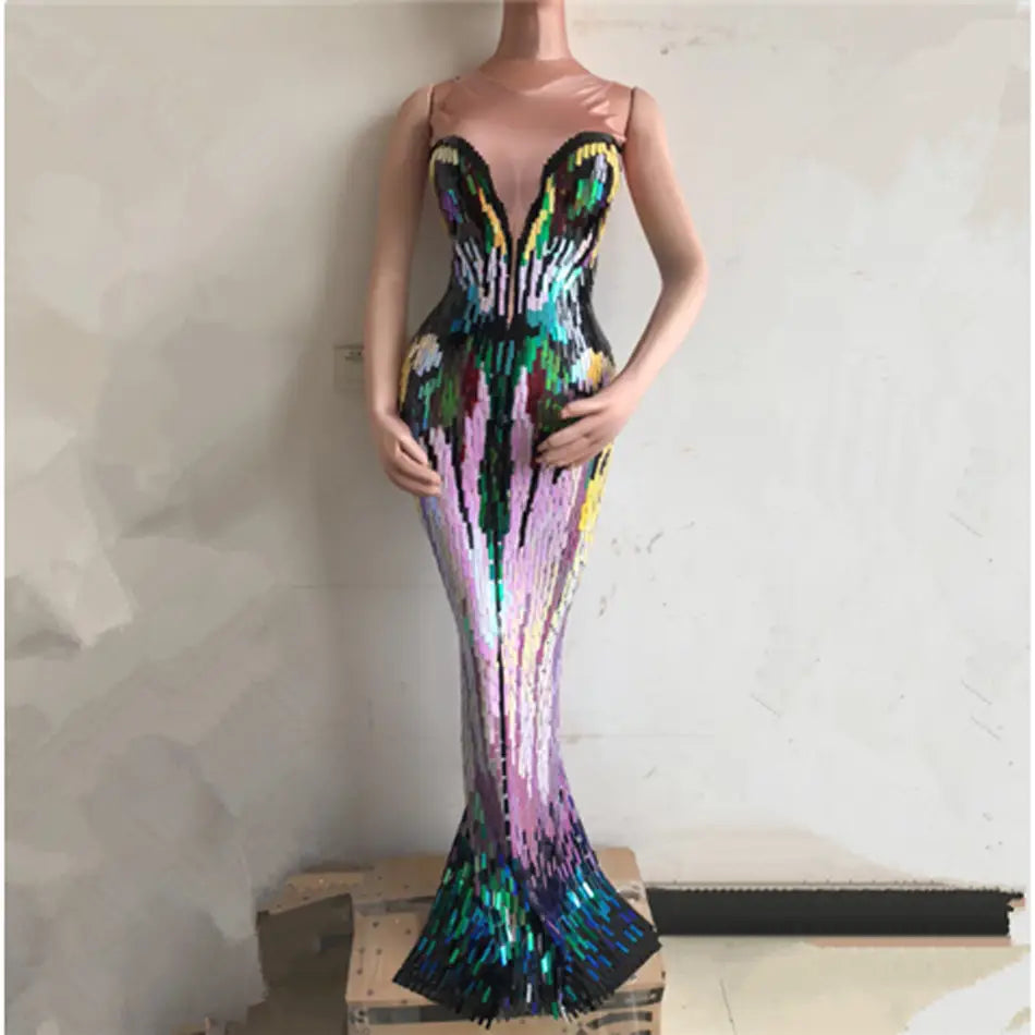 a shimmering mermaid-style sequin evening dress in a rainbow gradient of purple green and blue hues designed as an evening dress female singer costume