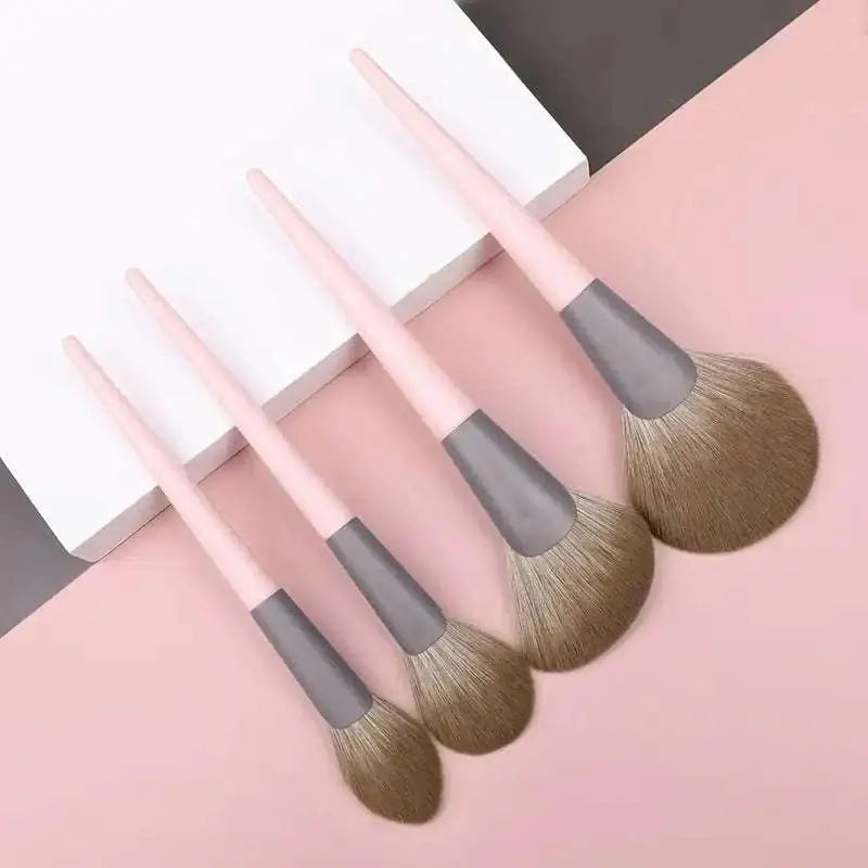 Set of four piece premium blush brushes with pink handles, gray ferrules, soft bristles for precise makeup application
