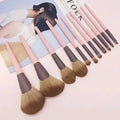 Set of ten piece premium pink and brown makeup brushes with soft bristles and leather makeup brush handles