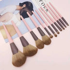 Set of ten piece premium pink and brown makeup brushes with soft bristles and leather makeup brush handles