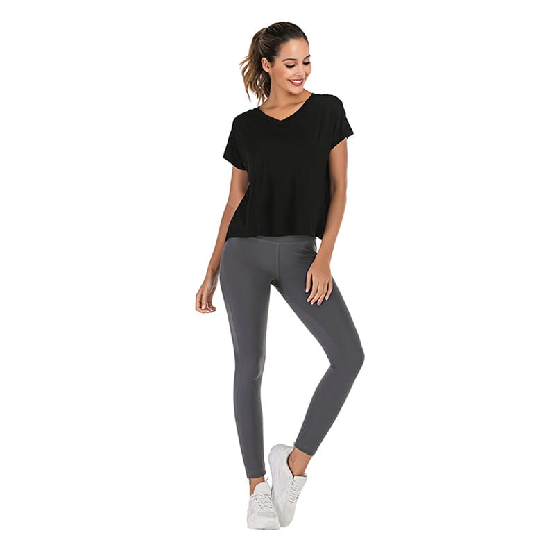 Black v-neck sports t-shirt with short sleeves and a relaxed flowing fit shown from the front designed for women’s activewear.