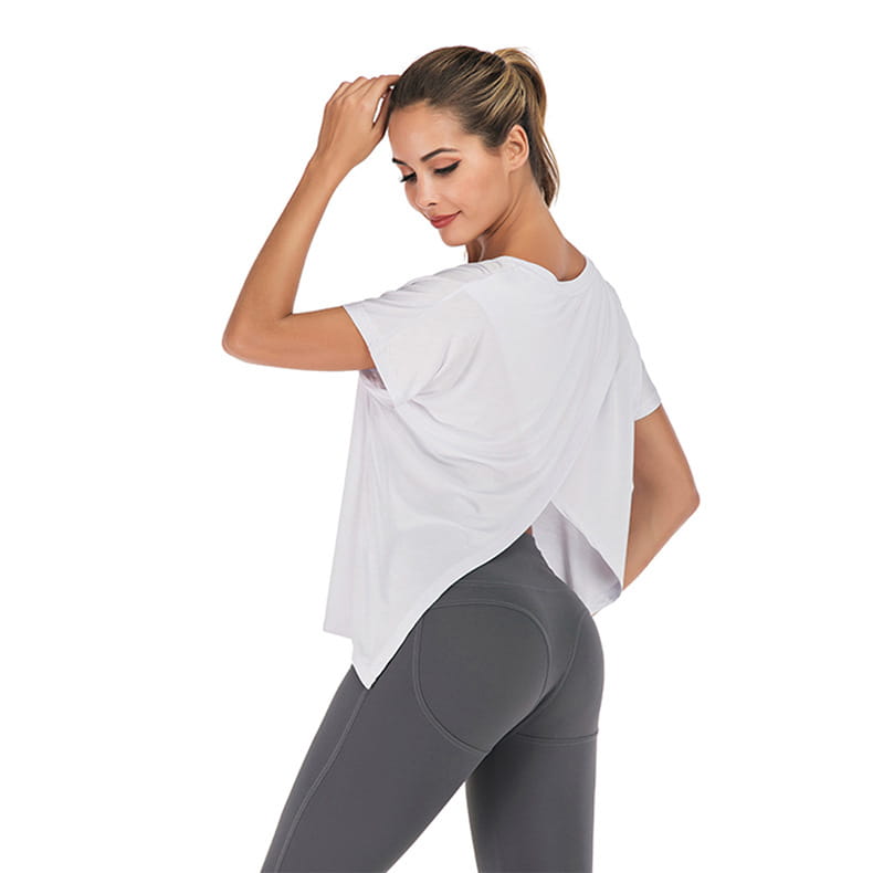 white loose-fitting short-sleeved v-neck sports t-shirt with draped back and asymmetrical hemline shown from the back