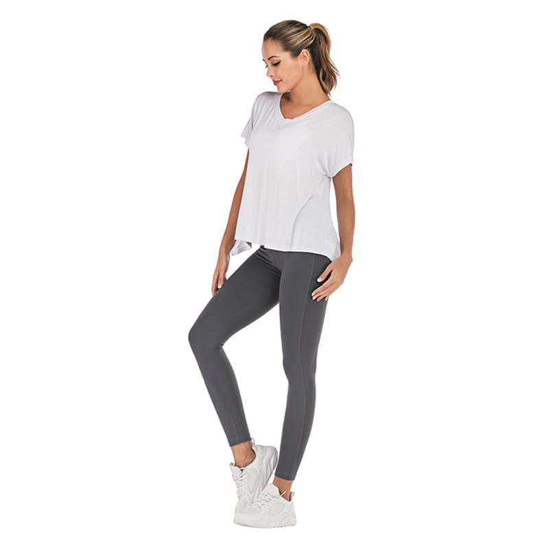 White short-sleeved v-neck sports t-shirt with a relaxed fit and subtle side slits suitable for athletic use.