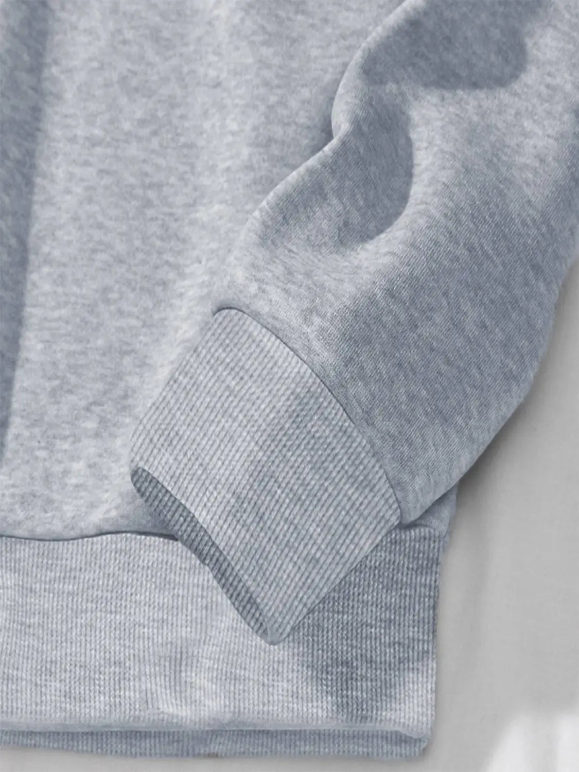gray heathered pocketed long sleeve sweatshirt sleeve with ribbed cuffs from the white glitter lips pocketed long sleeve sweatshirt collection