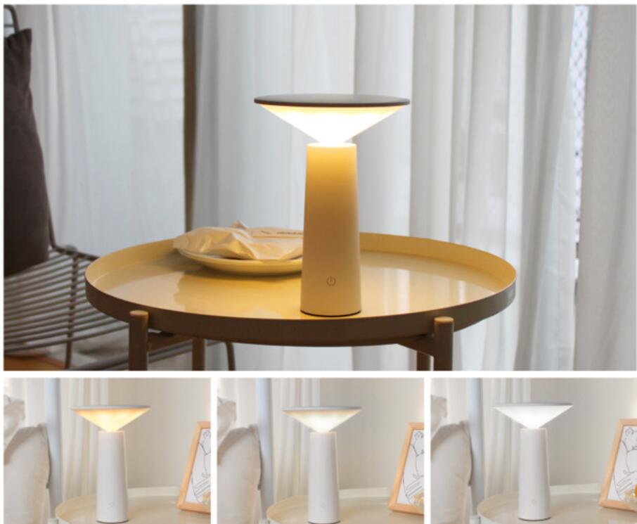 A sleek minimalist touch table lamp usb led with a warm yellow glow and modern design ideal for led reading.