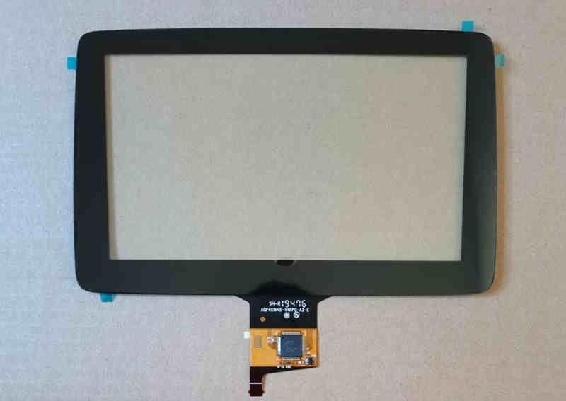 black rectangular original car exterior touch screen panel with flexible circuit board and connector at the bottom for car exterior screen replacement