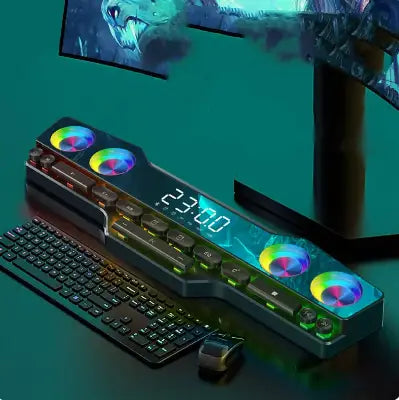 rgb gaming keyboard with wireless bluetooth speaker featuring rgb lighting and circular led accents along its edges for enhanced gaming and multimedia experience.