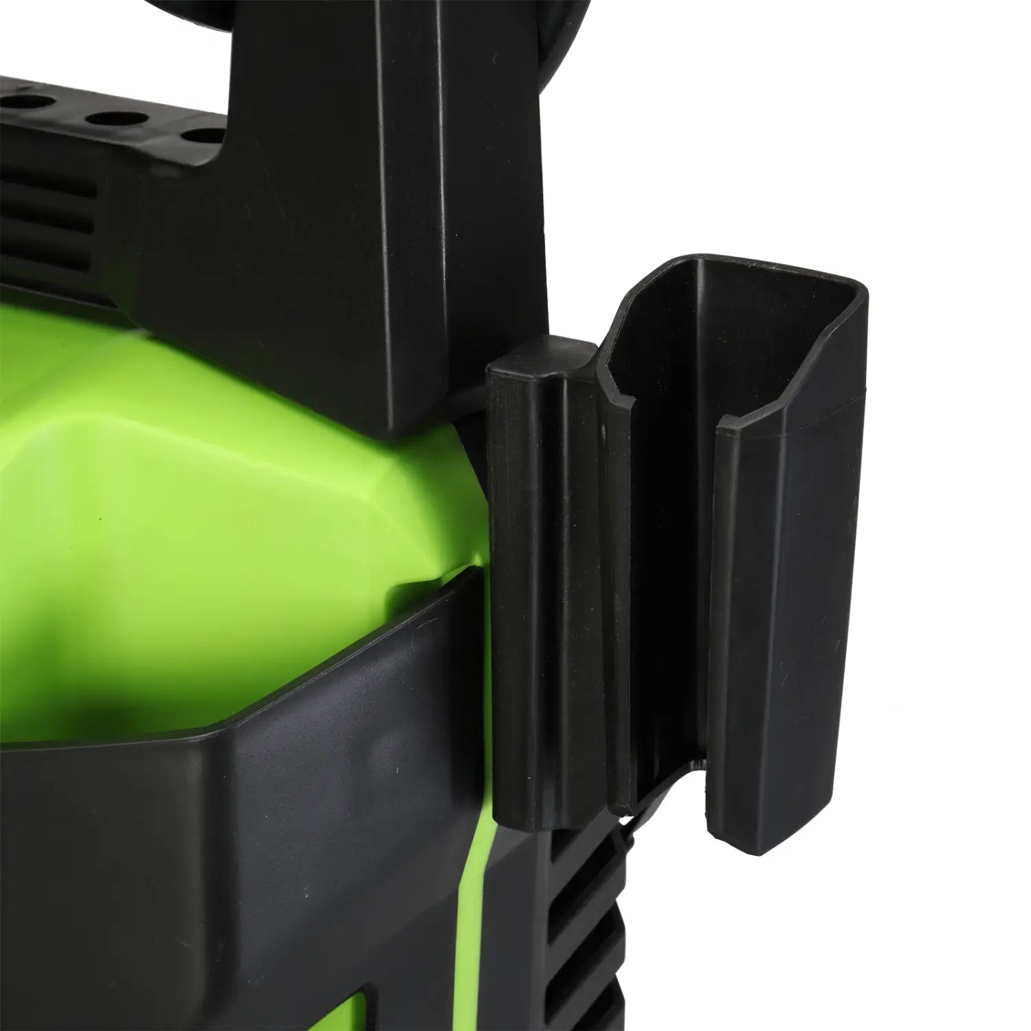 Black plastic mounting bracket with a lime green accent on the back side of a green and black high pressure cleaner with coiled hose