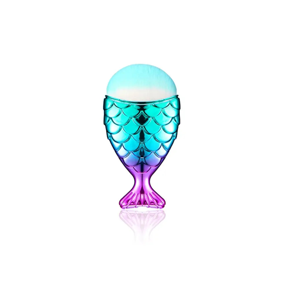 A translucent mermaid-scale perfume bottle with teal to purple gradient and light blue cap in 11pcs makeup brushes kit featuring palette