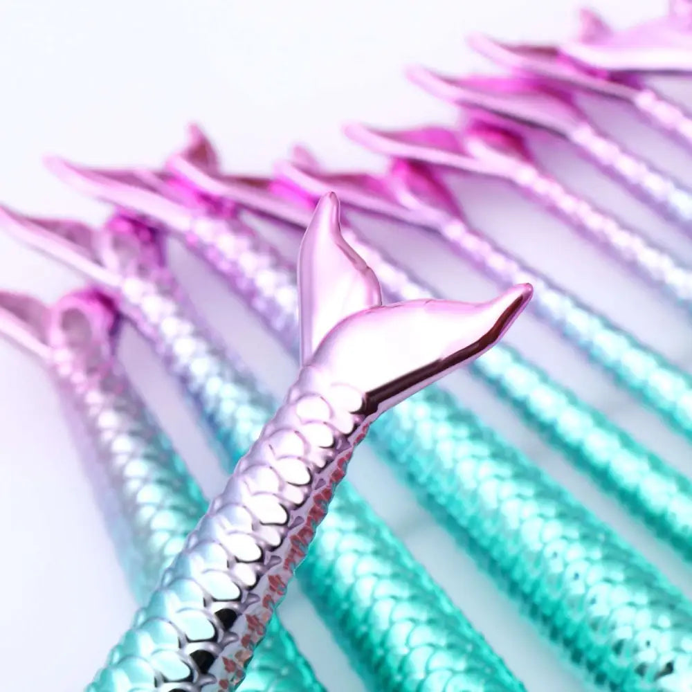 11pcs mermaid makeup brushes kit featuring iridescent pink purple and teal scales with mermaid-tail handles