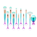 A set of 11pcs mermaid makeup brushes kit featuring iridescent teal and purple scales with rose gold ferrules