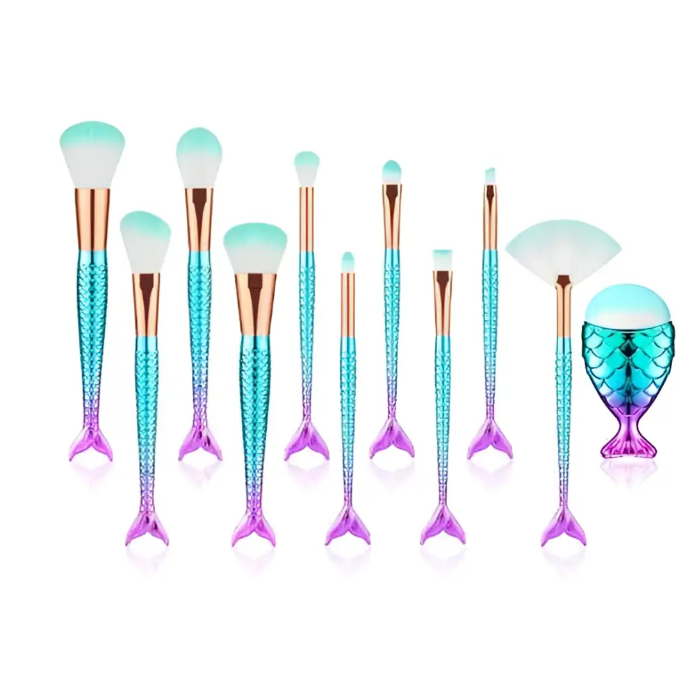 A set of 11pcs mermaid makeup brushes kit featuring iridescent teal and purple scales with rose gold ferrules