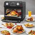 Black 12 liter air fryer oven with dual knob control and glass door displaying roasted chicken inside with temperature range