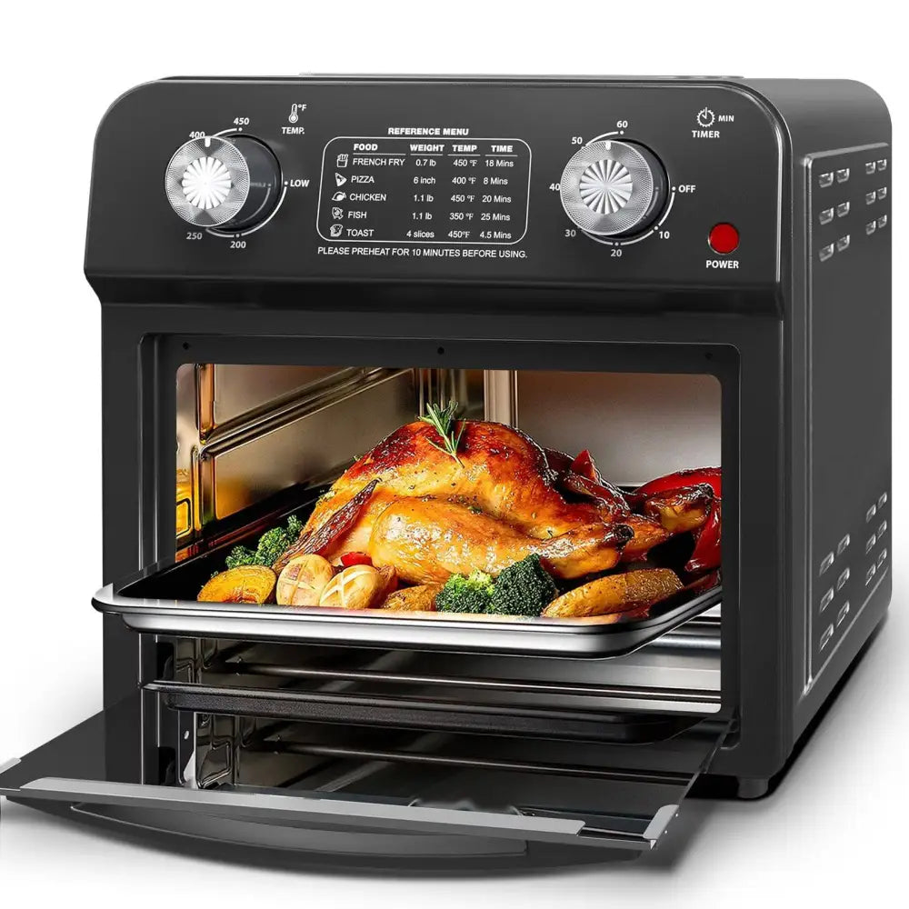 Black 12 liter air fryer oven with dual knob control and glass door roasting turkey and vegetables inside