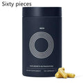 Dark blue cylindrical container with silver concentric circles labeled men holding 120 golden men hair care capsules