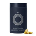 Dark blue cylindrical container labeled men hair care capsules with silver circle design and 120 capsules for hair growth