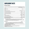 Back side of dark blue cylindrical 120 men hair care capsules bottle showing white label supplement facts panel with vitamins minerals and extracts