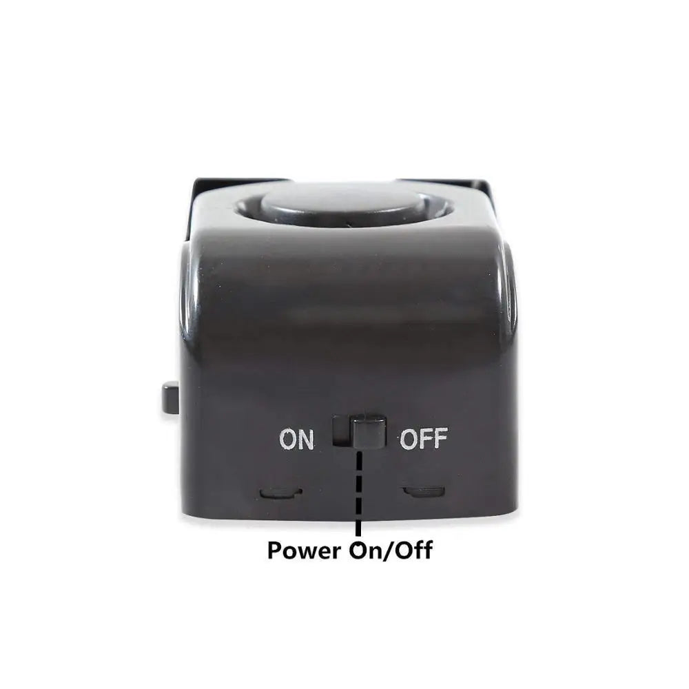 Black plastic burglar alarm wedge door stop with 120db electronic burglar sound deterrent feature