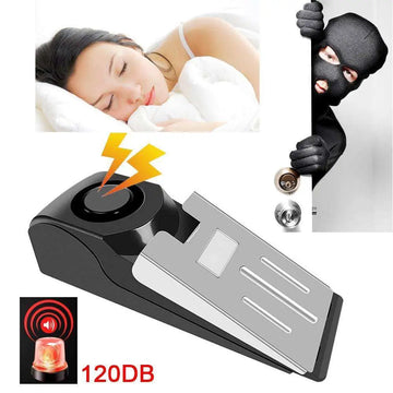 Black plastic burglar alarm wedge door stop with 120db electronic burglar sound deterrent feature