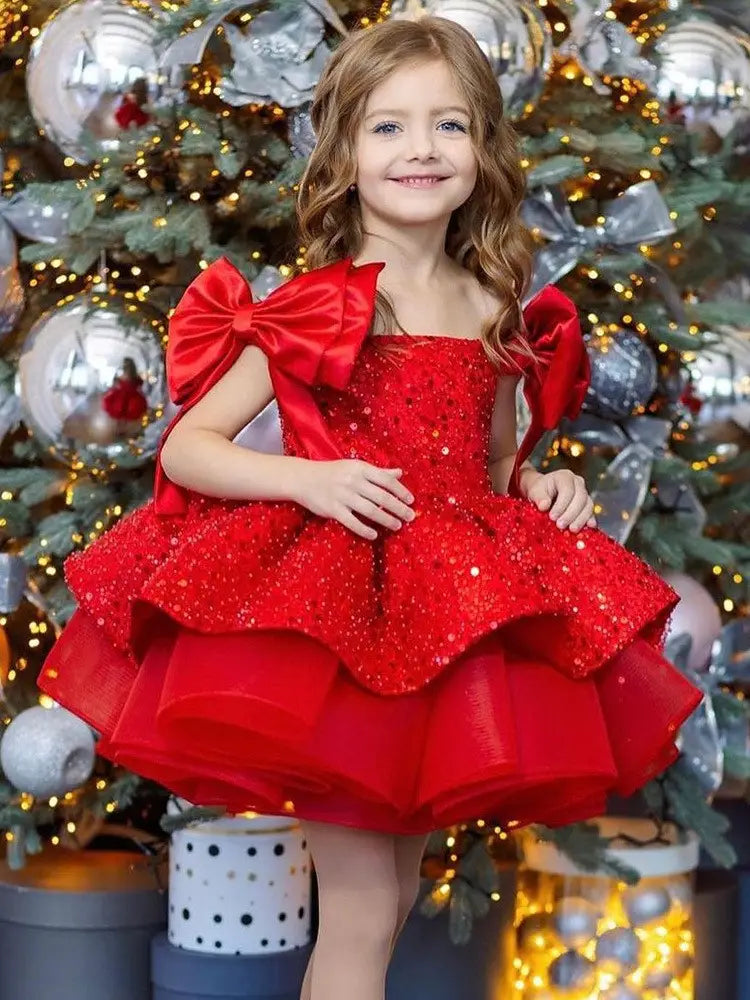 a vibrant princess dress red featuring a red sequined bodice, flared skirt with red tulle tutu, and large satin bow sleeves