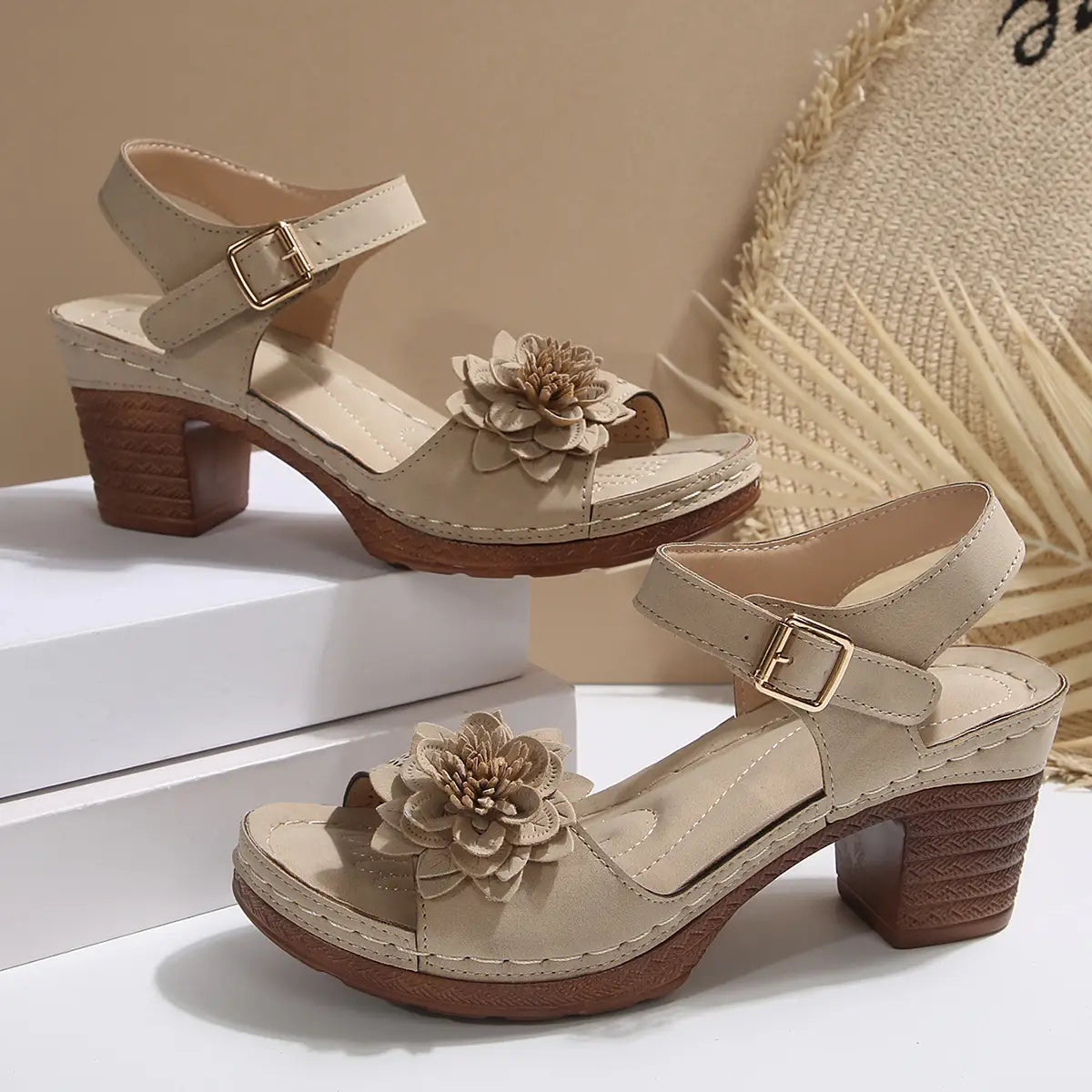 Beige floral flowers chunky heel sandals made of suede with a textured wooden block heel and a decorative fabric flower on the toe strap, ideal as heel sandals summer footwear.