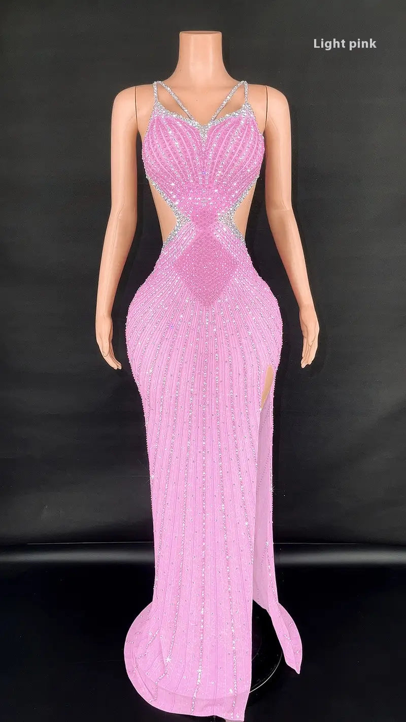 A light pink form-fitting evening gown with a beaded mermaid silhouette and silver embellishments along the neckline and sides from the sling super shiny collection featuring super shiny light diamond details.