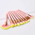 Set of 12pcs beauty makeup brushes with pink and yellow gradient bristles and rose gold ferrules with gold handles