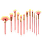 Set of 12pcs beauty makeup brushes with pink and gold handles and gradient yellow to pink bristles for versatile use
