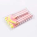 Set of 12pcs beauty makeup brushes with pink and yellow gradient bristles and gold handles in clear plastic packaging