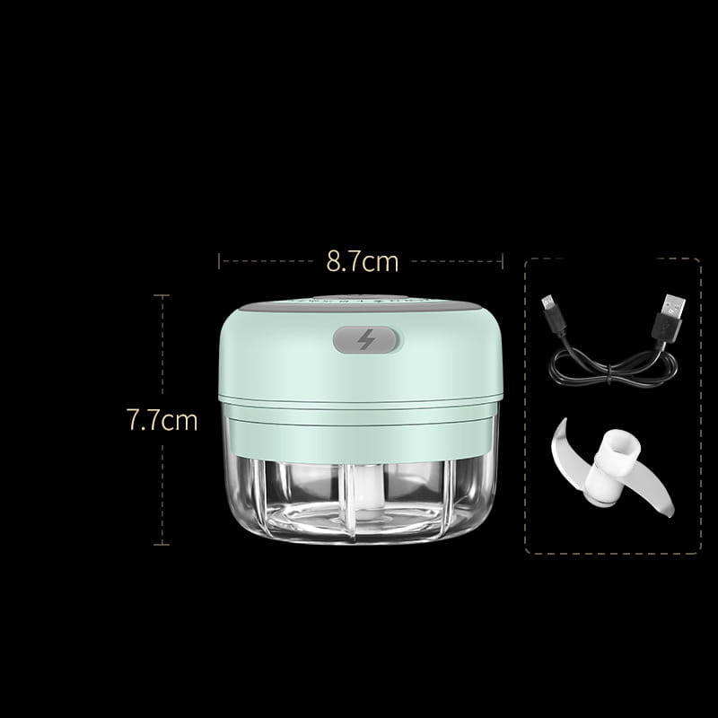 Wireless mini baby food supplement electric chopper in compact mint green and clear plastic with a white blade attachment and usb charging cable.