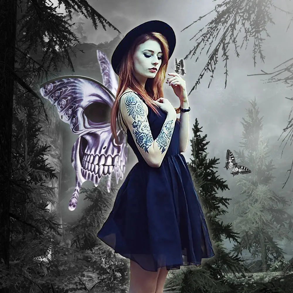 A woman in a navy blue dress with intricate floral tattoos wears a black hat and silver skull halloween butterfly wings flowing from her back.