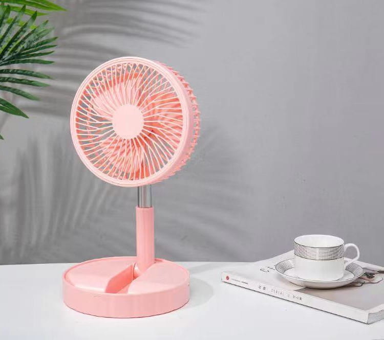 pink quiet portable telescopic folding fan with a circular grille and slender neck designed for tabletop use
