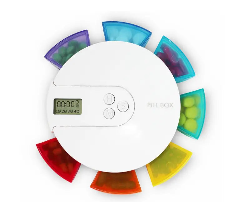white digital 7 compartment alarm clock pill dispenser with colorful translucent compartments arranged in a circular pattern