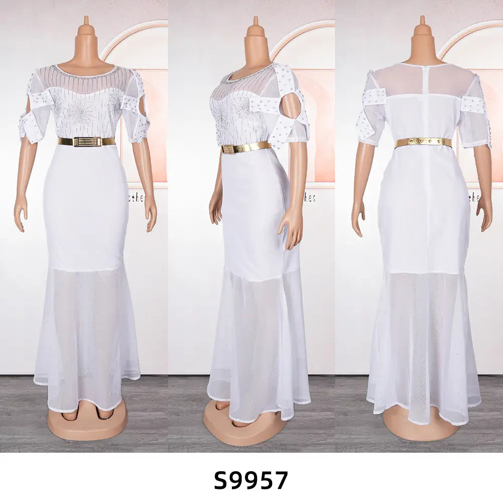 white mermaid-style dress with sheer mesh top, heavy embroidered hot diamond beads embellishments, and gold belt from royal blue heavy embroidered hot diamond beads gown collection.