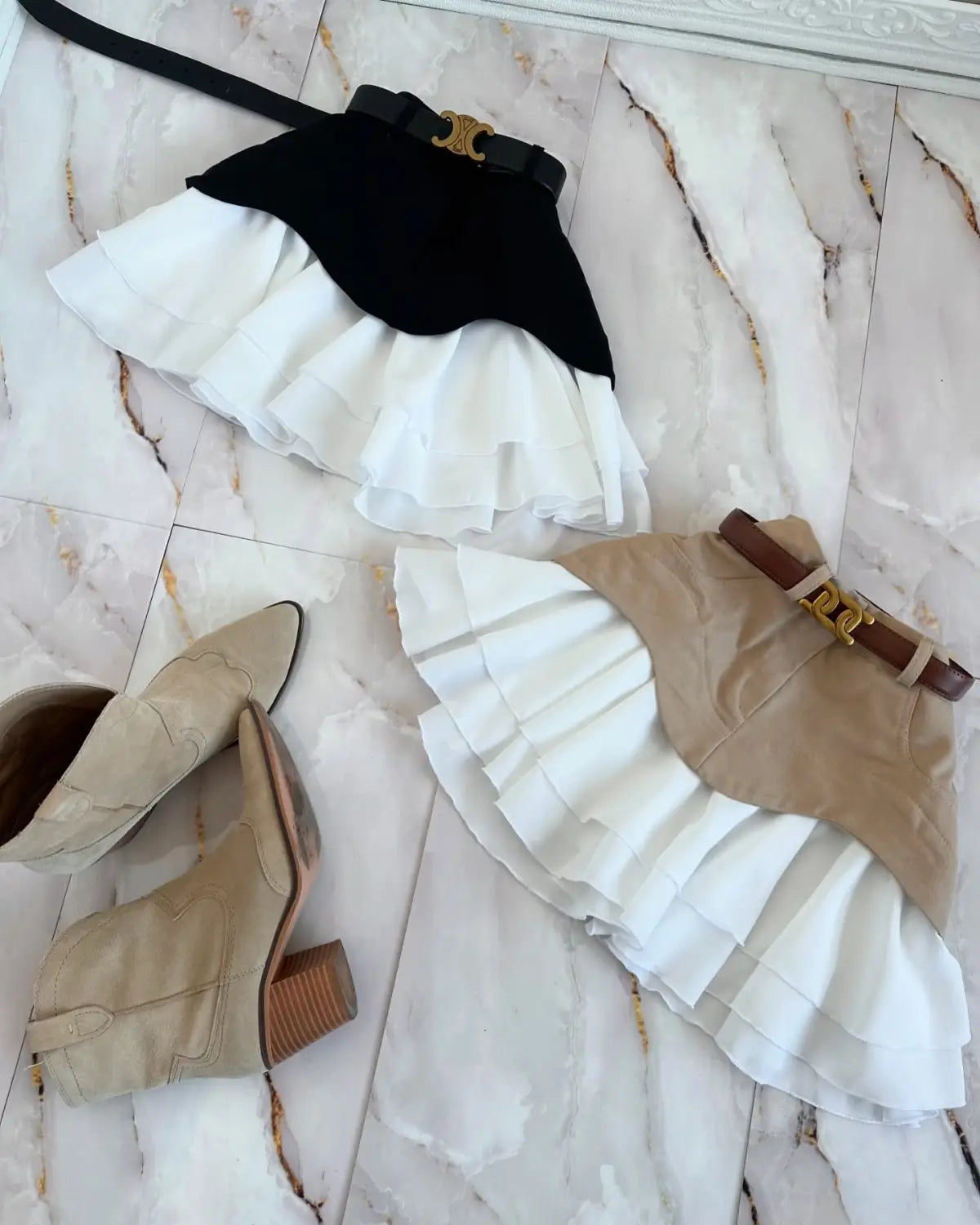 beige two tone ruffled high waist tiered skirt with a black and white ruffled design and contrasting solid top panel featuring a gold tone c logo waist tiered skirt belt buckle.