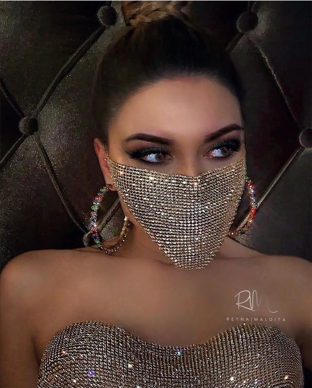 A sparkling gold rhinestone face mask with a fitted mesh design featuring explosive metal flash and metal flash jewelry elements in a flash jewelry mask style.
