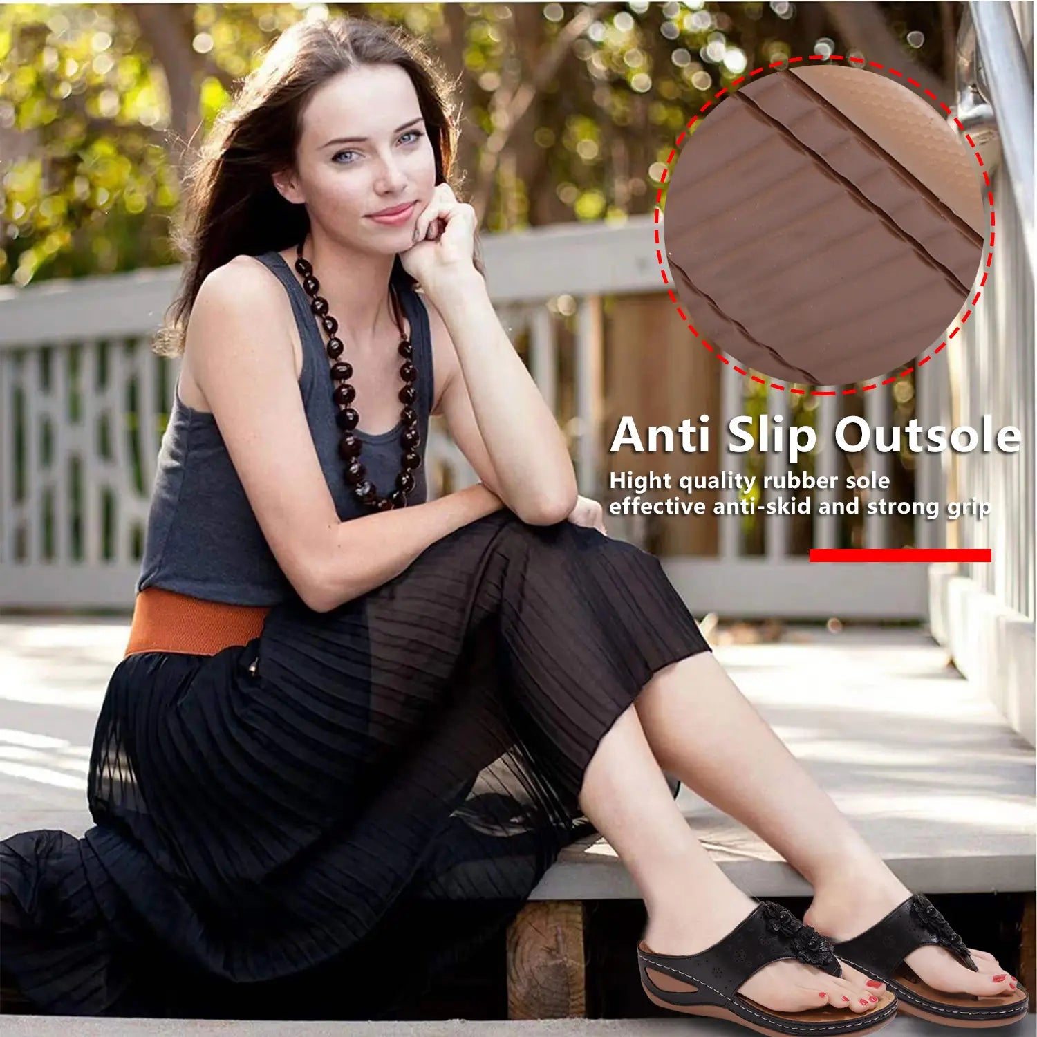 black leather thong sandals with brown rubber anti-slip outsole and decorative black floral embellishments designed as large size lightweight massage sandals