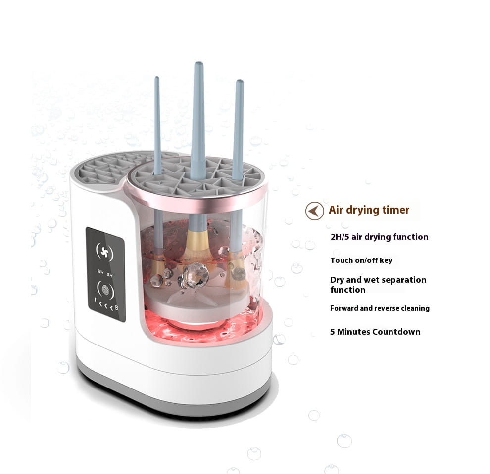 White and rose gold electric makeup brush cleaner station with transparent water tank and three vertical slots for brushes featuring a digital timer.