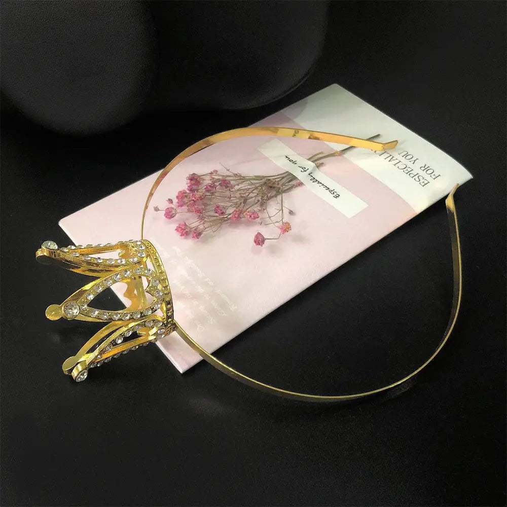 Gold-colored hair comb crown adorned with sparkling rhinestones as crown rhinestone accessories for children.