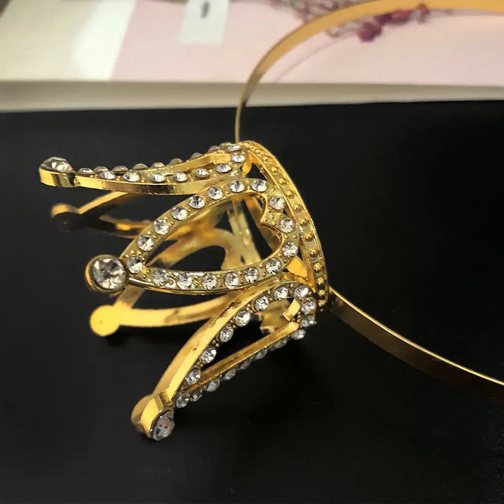 gold-colored hair comb crown adorned with clear rhinestones featuring intricate design as crown rhinestone accessories