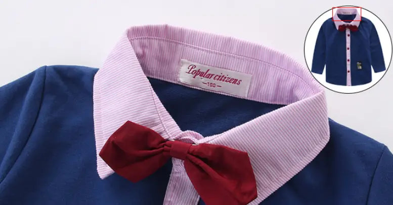 A navy blue corduroy button-up shirt with a light pink striped collar and matching bow tie from the men’s plaid suspenders treasure suit tide suit collection.