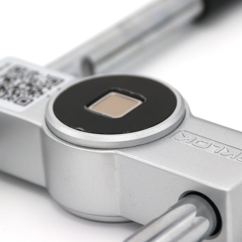 Silver metallic torque wrench with black circular dial housing and engraved brand name for use with silver black home smart fingerprint door lock.