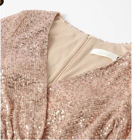 A shimmering rose gold sequined evening dress with a soft textured fabric, delicate v-neckline, and sexy high slit, designed as a fantasy celebrity sexy high dress.