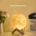 Warm glowing 16-colour remote control moon night table lamp with realistic moon surface and wooden tripod base